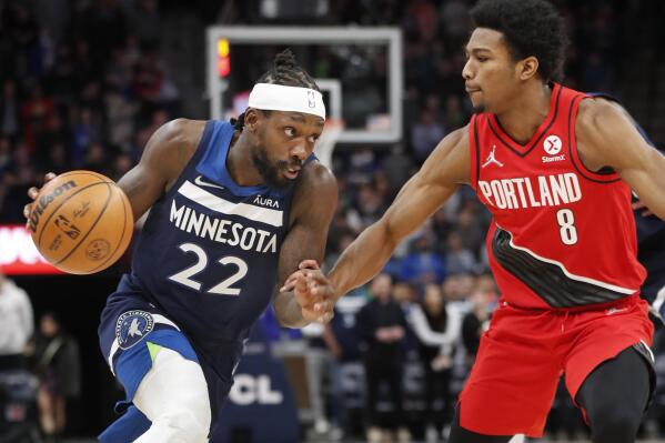 Minnesota Timberwolves guard Patrick Beverley (22) brings the ball around Portland Trail Blazers guard Brandon Williams (8) in the first quarter of an NBA basketball game Monday, March 7, 2022, in Minneapolis. (AP Photo/Bruce Kluckhohn)