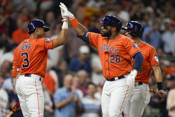 Houston Astros' Jon Singleton (28) celebrates his two-run home run against the Los Angeles Angels with Jeremy Pena (3) during the third inning of a baseball game Friday, Aug. 11, 2023, in Houston. (AP Photo/Eric Christian Smith)