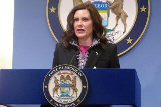 FILE - Michigan Gov. Gretchen Whitmer speaks at a news conference on Friday, March 11, 2022, at the governor's office in Lansing, Mich. A judge on Tuesday, MAY 17, 2022, suspended Michigan's dormant, decades-old ban on abortion, which means the procedure would not be illegal in the state even if the U.S. Supreme Court overturned its historic Roe v. Wade decision. (AP Photo/David Eggert, File)