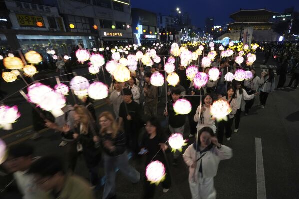 Participants march during the Yeon Deung Hoe, or Lotus Lantern Festival, ahead of the Buddha's birthday on May 5, in downtown Seoul, South Korea, Saturday, April 26, 2025. (AP Photo/Lee Jin-man)