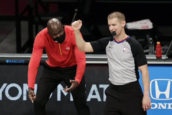 FILE - In this Friday, Jan. 1, 2021, file photo, Atlanta Hawks head coach Lloyd Pierce reacts to a call by referee Tyler Ford during an NBA basketball game against the Brooklyn Nets, in New York. On Monday, March 1, 2021, Pierce was fired less than halfway into a season that began with heightened expectations but was beset by injuries. (AP Photo/Adam Hunger, File)