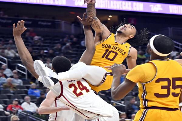 Arizona State guard Frankie Collins (10) shoots against Southern California forward Joshua Morgan (24) during the second half of an NCAA college basketball game in the quarterfinals of the Pac-12 Tournament, Thursday, March 9, 2023, in Las Vegas. (AP Photo/David Becker)
