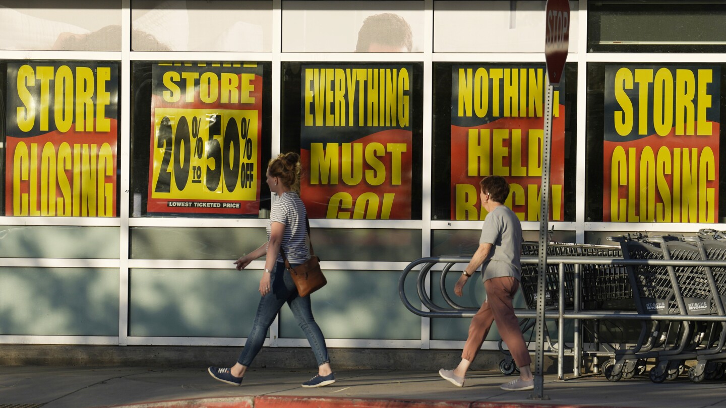 FILE - Shoppers enter exit a Bed Bath & Beyond store Monday, May 29, 2023, in Glendale, Colo. The big-box chain is staging store closing sales at 