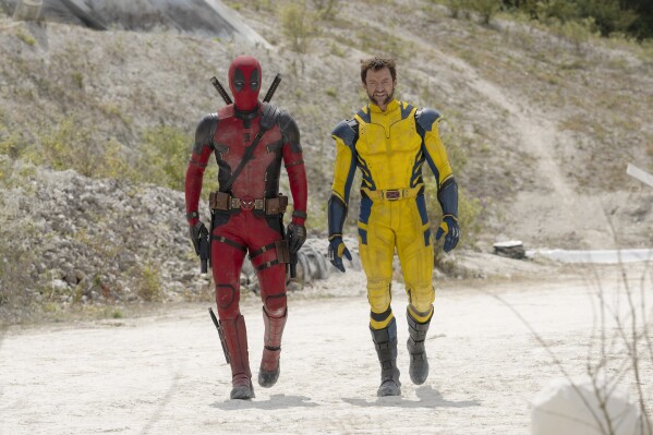 This image released by 20th Century Studios/Marvel Studios shows Ryan Reynolds as Deadpool/Wade Wilson and Hugh Jackman as Wolverine/Logan in a scene from 