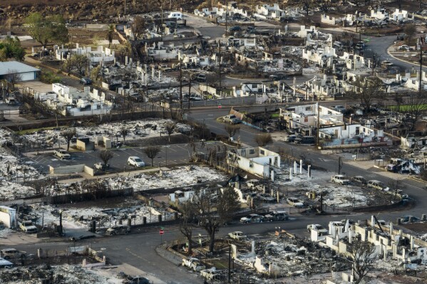 FILE - A general view shows the aftermath of a wildfire in Lahaina, Hawaii, on Aug. 17, 2023. When the town of Lahaina, which was leveled by wildfire in August, is rebuilt, local residents who survived the conflagration might not be able to afford to live there, leading economists warned on Friday, Sept. 22, 2023. (AP Photo/Jae C. Hong, File)