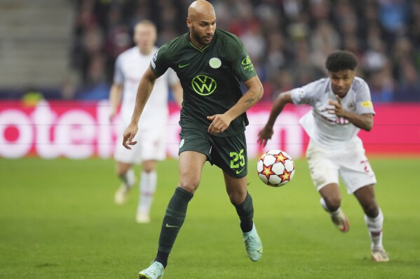 FILE - Wolfsburg's John Brooks runs with the ball during the Champions League group G soccer match between Salzburg and VfL Wolfsburg in Salzburg, Austria, on Oct. 20, 2021. United States defender John Brooks is set to leave German Bundesliga club Hoffenheim as a free agent when his contract expires next month. (AP Photo/Matthias Schrader, File)