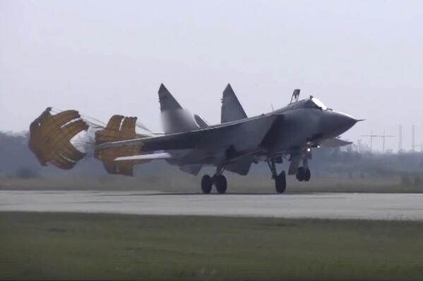 In this handout photo taken from video released by Russian Defense Ministry Press Service on Thursday, Aug. 18, 2022, a MiG-31 fighter jet of the Russian air force lands at the Chkalovsk air base in the Kaliningrad region. The Russian Defense Ministry said three MiG-31 fighters equipped to carry Kinzhal hypersonic missiles were deployed to the region as part of "additional measures of strategic deterrence." (Russian Defense Ministry Press Service photo via AP)