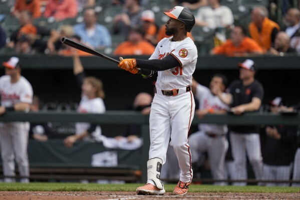 Baltimore Orioles' Cedric Mullins watches the ball after hitting a walk-off home run in the ninth inning of a baseball game against the Minnesota Twins, Wednesday, April 17, 2024, in Baltimore. The Orioles won 4-2. (AP Photo/Jess Rapfogel)