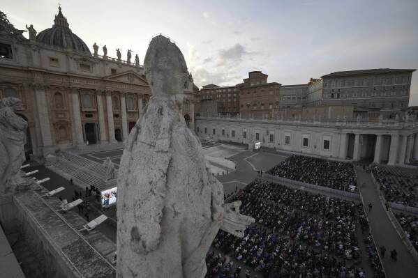 Faithful gather for a rosary prayer for the late Pope Francis, in St. Peter's Square at the Vatican, Monday April 21, 2025. (AP Photo/Andrew Medichini)