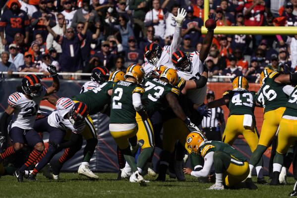 Rodgers throws 2 TDs, runs for 1 as Packers beat Bears 24-14