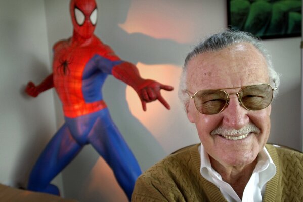 
              This April 16, 2002 file photo shows Stan Lee, creator of comic-book franchises such as "Spider-Man," "The Incredible Hulk" and "X-Men," posing near a Spider-Man figure in his Santa Monica, Calif., office. Friends, fans and family of Stan Lee will gather in Hollywood on Jan. 30 for a memorial honoring the life and work of late Marvel Comics mogul. (AP Photo/Reed Saxon, File)
            
