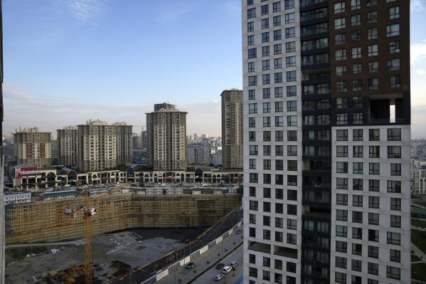 A view of buildings, part of residential compounds in Istanbul, Tuesday Dec. 8, 2022. Economic turmoil driven by inflation of 85% has plunged Turkey into one of its worst property crises. Skyrocketing prices have made finding affordable housing to rent or buy an uphill battle for many, especially for millions earning minimum wage who also struggle to cover food and energy costs. Increasing construction costs and inflation have pushed up housing prices globally. (AP Photo/Khalil Hamra)