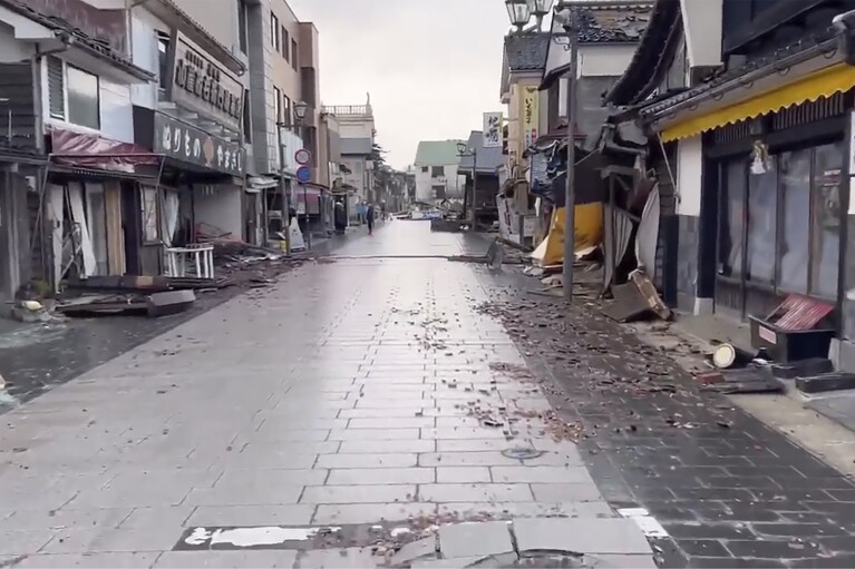This image from video provided by Yoshie Minamidani, shows the damages from a powerful earthquake in Wajima, Ishikawa prefecture, Japan, January 2024. Minamidani is a survivor of a powerful earthquake that hit western Japan on New Year’s Day. The seafood store she ran in Wajima, the hardest hit city, was seriously damaged, as was the storage filled with her precious preserved fish. She told The Associated Press Tuesday she is determined to bring Wajima back. (Yoshie Minamidani via AP)