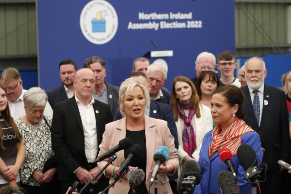 Sinn Fein's Michelle O'Neill, left, and party leader Mary Lou McDonald speak to the media at the Medow Bank election count centre on Saturday, May, 7, 2022, in Magherafelt , Northern Ireland. (AP Photo/Peter Morrison)