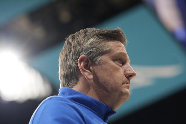 Minnesota Timberwolves head coach Chris Finch looks on in the first half of an NBA basketball game against the Denver Nuggets, Friday, April 1, 2022, in Denver. (AP Photo/David Zalubowski)