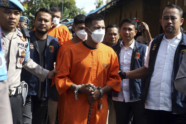 Indonesian police arrest three Mexicans after a Turkish tourist was wounded in an armed robbery in Bali, Indonesia on Tuesday, Jan. 30, 2024. Indonesian police said Tuesday they have arrested three Mexicans for alleged robbery on the resort island of Bali that left a tourist from Turkey badly wounded. (AP Photo/Firdia Lisnawati)