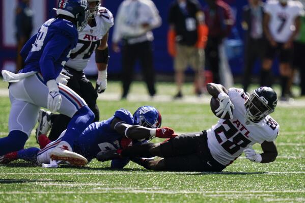 Atlanta Falcons running back Mike Davis (28) is tackled by New York Giants free safety Jabrill Peppers (21) before fumbling for a recover by Giant's Lorenzo Carter during the first half of an NFL football game, Sunday, Sept. 26, 2021, in East Rutherford, N.J. (AP Photo/Seth Wenig)