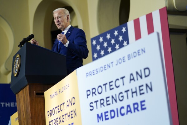 FILE - President Joe Biden speaks about his administration's plans to protect Social Security and Medicare and lower healthcare costs, Thursday, Feb. 9, 2023, at the University of Tampa in Tampa, Fla. Biden is trumpeting Medicare’s new powers to negotiate directly with drugmakers on the cost of prescription medications, but a new poll from The Associated Press-NORC Center for Public Affairs Research shows that any immediate political boost that Biden gets may be limited. (AP Photo/Patrick Semansky, File)