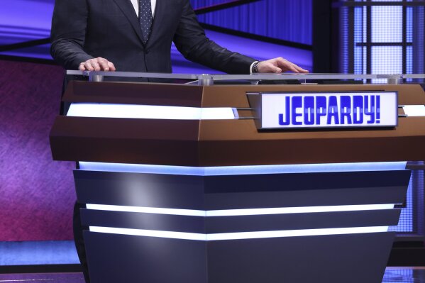This image released by Jeopardy Productions, Inc. shows Green Bay Packers quarterback Aaron Rodgers as he guest hosts the game show "Jeopardy!" Rodgers is hosting the popular game show for the next two weeks as the show goes through a series of guest hosts to replace Alex Trebek, who died of cancer on Nov. 8. (Carol Kaelson/Jeopardy Productions, Inc. via AP)