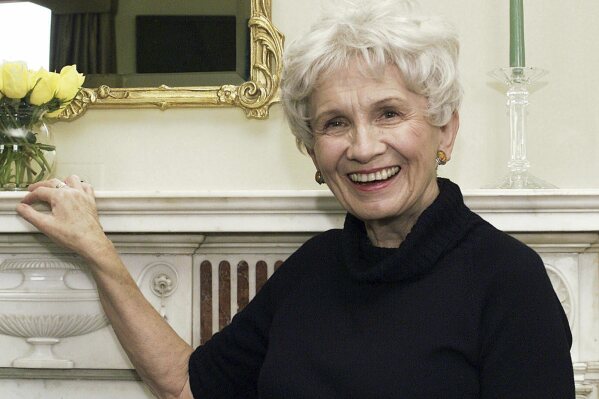 FILE - Canadian author Alice Munro poses for a photograph at the Canadian Consulate's residence in New York on Oct. 28, 2002. Munro, the Canadian literary giant who became one of the world’s most esteemed contemporary authors and one of history's most honored short story writers, has died at age 92. (AP Photo/Paul Hawthorne, File)