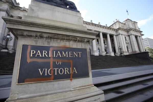 A Nazi swastika is seen graffitied on the front of the Victorian State Parliament in Melbourne, Australia, Monday, Oct. 1, 2012. New South Wales, the nation’s most populous state, on Thursday, Aug. 11, 2022, followed Victoria, the second-most populous, which banned the public display of Nazi swastikas in June. (AAP Image/David Crosling)
