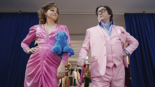 This image released by Apple TV shows Elizabeth Banks, left, and Zach Galifianakis in a scene from 