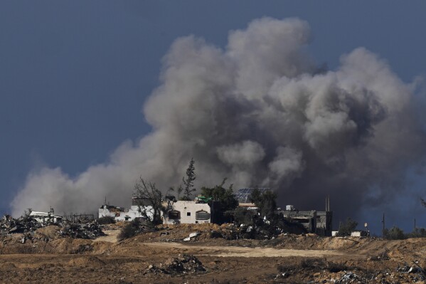 Smoke rises following an Israeli bombardment in the Gaza Strip, as seen from southern Israel, Sunday, Jan.7, 2024. The army is battling Palestinian militants across Gaza in the war ignited by Hamas' Oct. 7 attack on Israel. (AP Photo/Ohad Zwigenberg)