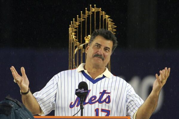FILE - Keith Hernandez, a member of the 1986 World Champion New York Mets team, speaks to fans during a pre-game ceremony to honor the 20th anniversary of the Mets 1986 team before the Mets played a baseball game against the Colorado Rockies, on Aug. 19, 2006, at Shea Stadium in New York. A captain and commentator who has been beloved in Queens for nearly four decades, Hernandez will have his No. 17 retired by the Mets prior to a July 9, 2022, game against Miami. (AP Photo/Ed Betz, File)