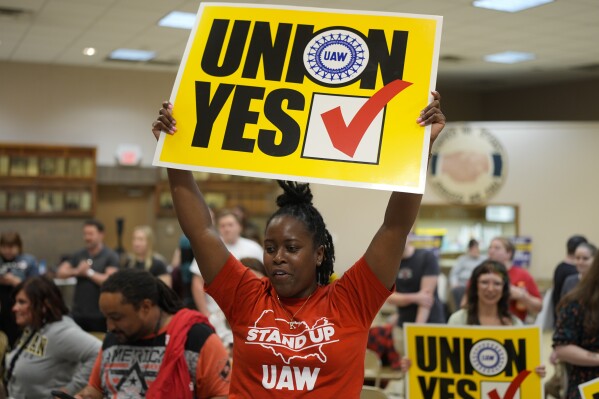 Volkswagen automobile plant employee Kiara Hughes celebrates after employees voted to join the UAW union Friday, April 19, 2024, in Chattanooga, Tenn. (AP Photo/George Walker IV)