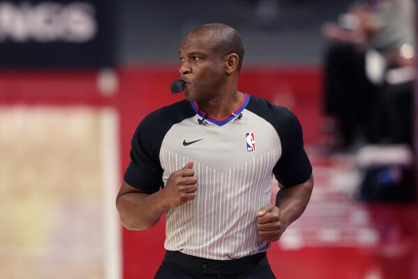 FILE - Referee Tony Brown runs on the sideline during the first half of an NBA basketball game between the Detroit Pistons and the Toronto Raptors, March 17, 2021, in Detroit. Brown, who was diagnosed with Stage 4 pancreatic cancer in April 2021, died Thursday, Oct. 20, 2022. He was 55. (AP Photo/Carlos Osorio, File)