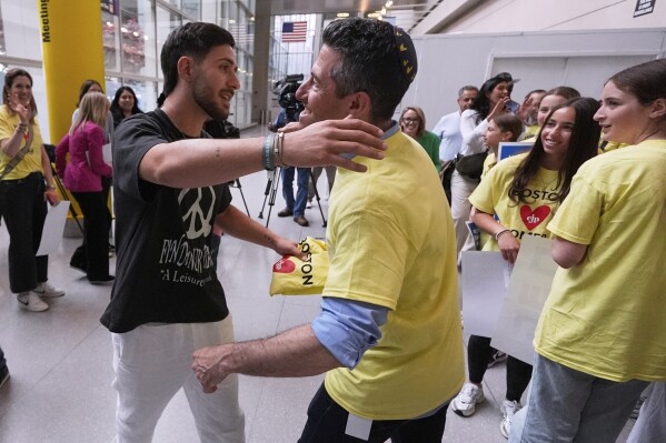 Omer Shem Tov, an Israeli hostage who survived over 500 days in Hamas captivity, is welcomed during his arrival at Logan Airport, Thursday, May 15, 2025, in Boston. (AP Photo/Charles Krupa)