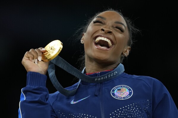 Simone Biles earns seventh Olympic gold medal by winning women's vault | AP  News