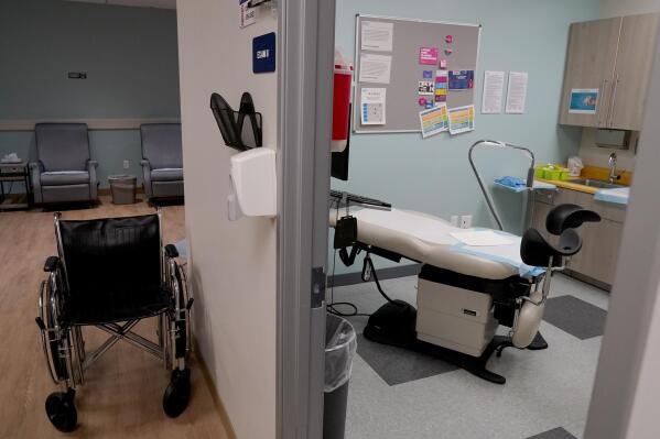 An empty recovery area, left, and abortion procedure room are shown, Thursday, June 30, 2022, at the Planned Parenthood facility in Tempe, Ariz. Arizona Republican Attorney General Mark Brnovich has agreed not to enforce a near total ban on abortions at least until 2023, a move that Planned Parenthood Arizona credited Thursday, Oct. 27, 2022, with allowing the group to restart abortion care across the state. (AP Photo/Matt York)