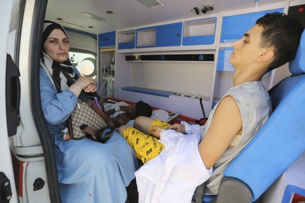 Palestinian ambulances with people wounded in the Israeli bombing of the Gaza Strip arrive at the border crossing with Egypt on Wednesday, Nov. 1, 2023. (AP Photo/Hatem Ali)