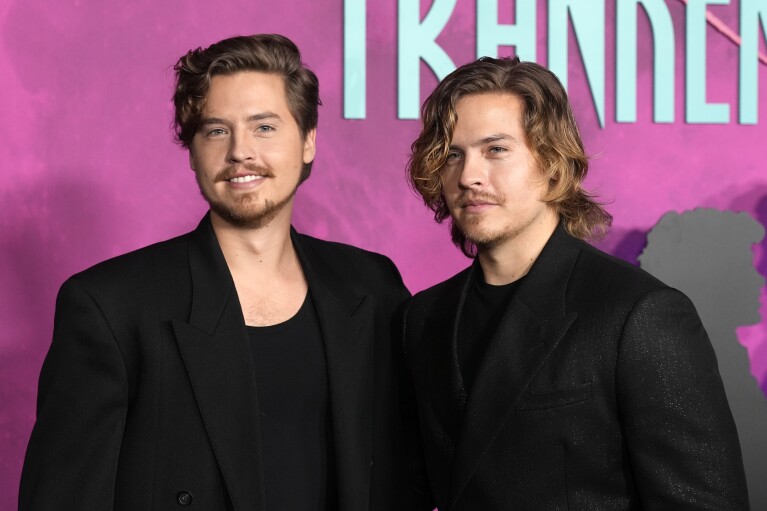 Cole Sprouse, left, a cast member in "Lisa Frankenstein," poses with his twin brother, Dylan, at the premiere of the film. (APPhoto/Chris Pizzello)