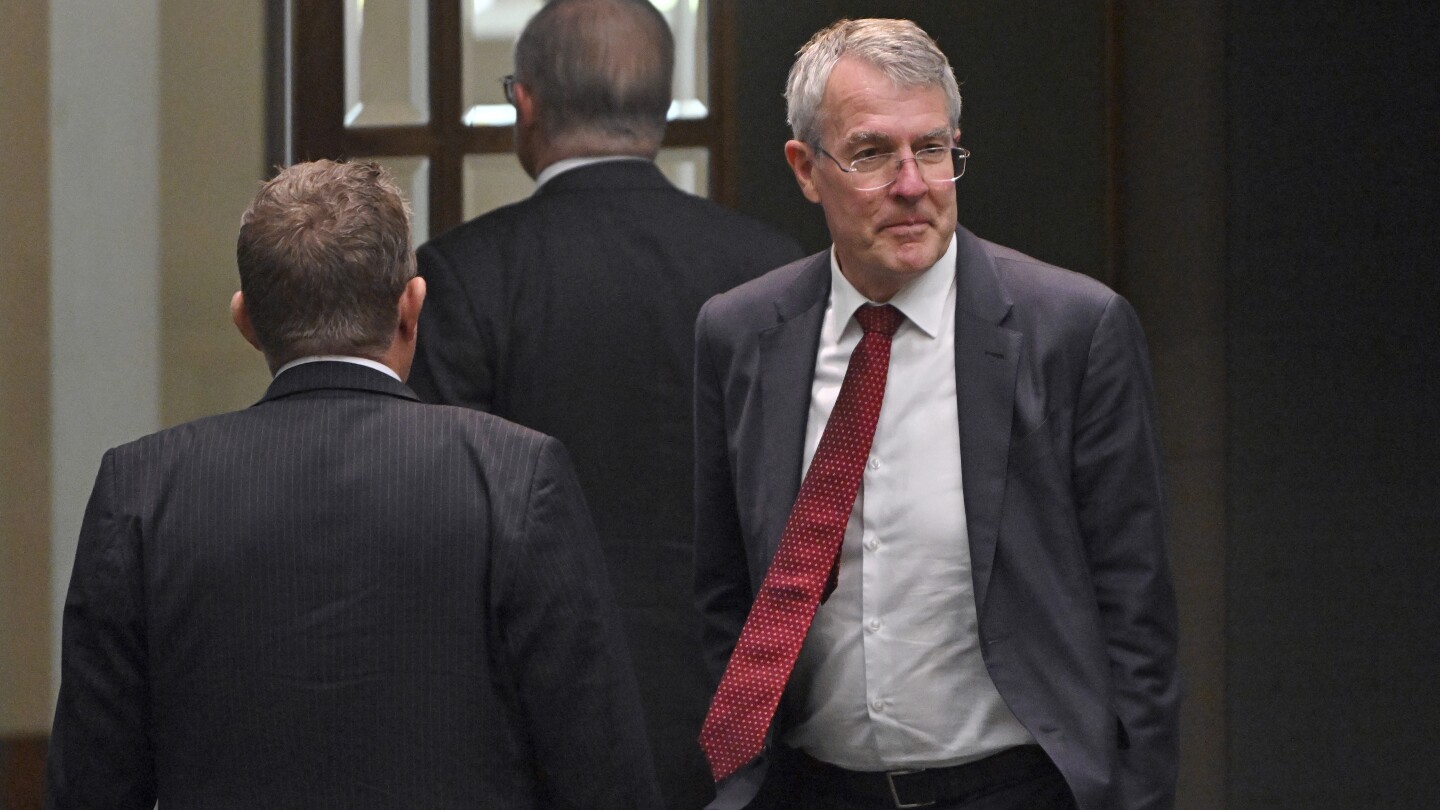 Australia’s Attorney-General Mark Dreyfus leaves the house of representatives at Parliament House in Canberra, Tuesday, Feb. 13, 2024. The Australia