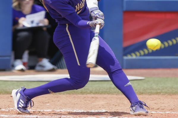 Washington's Rylee Holtorf hits a home run against Utah during the second inning of an NCAA softball Women's College World Series game Friday, June 2, 2023, in Oklahoma City. (AP Photo/Nate Billings)