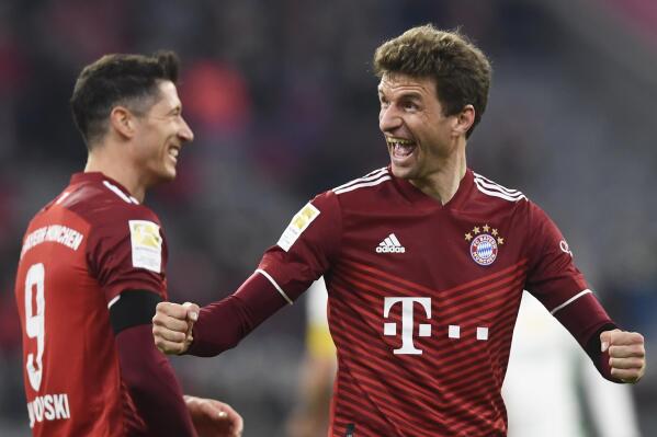 Bayern's Thomas Mueller, right, and Robert Lewandowski react during the German Bundesliga soccer match between FC Bayern Munich and 1 FC Union Berlin at the Allianz Arena in Munich, Germany, Saturday, March 19, 2022. (AP Photo/Andreas Schaad)