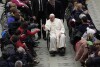 Pope Francis leaves after an audience with sick people and Lourdes pilgrimage operators in the Paul VI Hall, at the Vatican, Thursday, Dec. 14, 2023. (AP Photo/Alessandra Tarantino)