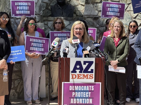 FILE - Phoenix Mayor Kate Gallego speaks to reporters at the state Capitol in Phoenix on April 9, 2024. The near-total abortion ban resurrected last week by the Arizona Supreme Court dates to 1864, a time when gold-seekers were moving in, dueling had to be regulated and the U.S. Army was forcibly removing Native Americans from their land. The law's revival is just the latest instance of long-dormant restrictions influencing current abortion policies after the overturning of Roe v. Wade. (AP Photo/Jonathan Copper)