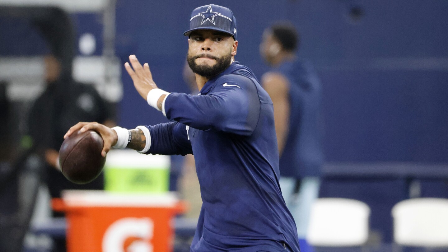 Dallas Cowboys quarterback Dak Prescott (4) looks to pass during a  Thanksgiving day NFL football game against the Las Vegas Raiders, Thursday,  Nov. 25, 2021, in Arlington, Texas. (AP Photo/Matt Patterson Stock