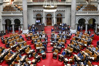 FILE - The New York state Assembly Chamber is seen during a legislative session after Gov. Kathy Hochul presented her 2025 executive state budget at the state Capitol Tuesday, Jan. 16, 2024, in Albany, N.Y. New York lawmakers are expected to miss the state's budget deadline as negotiations over housing and education funding remain ongoing, a top official said Wednesday, March 27, 2024. (AP Photo/Hans Pennink, File)