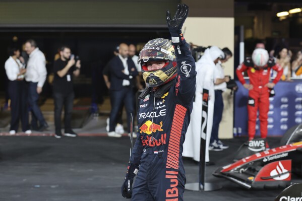 Red Bull driver Max Verstappen of the Netherlands waves after qualifying session ahead of the Abu Dhabi Formula One Grand Prix at the Yas Marina Circuit, Abu Dhabi, UAE, Saturday, Nov. 25, 2023. (Ali Haider/Pool via AP)