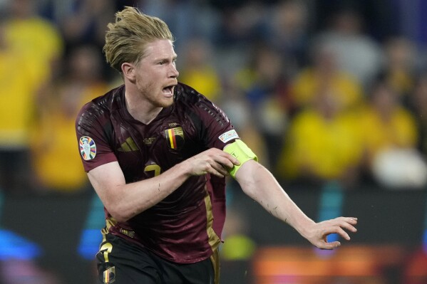  Belgium's Kevin De Bruyne celebrates after scoring his side's second goal during a Group E match between Belgium and Romania at the Euro 2024 soccer tournament in Cologne, Germany, Saturday, June 22, 2024. (AP Photo/Martin Meissner)