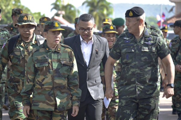 In this photo released by the Thai Royal Thai Army, Cambodian Chief of Army Mao Sophan, left, meets with Thailand Chief of Army Gen. Pana Claewplodtook, right, at a border checkpoint in Surin province, Thailand, May 29, 2025. (Thai Royal Thai Army via AP, file)