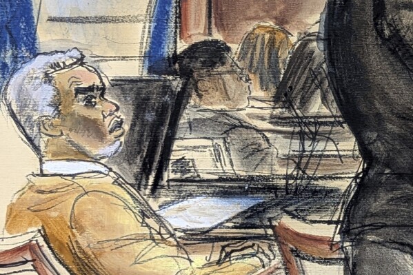Sean "Diddy" Combs looks on as defense attorney Nicole Westmoreland cross examines Dawn Richard during Combs' sex trafficking and racketeering trial in Manhattan federal court, Monday, May 19, 2025, in New York. (Elizabeth Williams via AP)