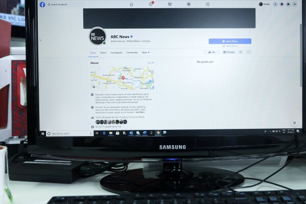 An Australian Broadcasting Corporation page on Facebook is displayed without posts in Sydney, Thursday, Feb. 18, 2021. Facebook is vowing to restrict news sharing as Australian lawmakers consider forcing digital giants into payment agreements. (AP Photo/Rick Rycroft)