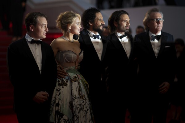 Gabriel Sherman, from left, Maria Bakalova, director Ali Abbasi, Sebastian Stan, and Martin Donovan pose for photographers upon departure from premiere of the film 'The Apprentice' at the 77th international film festival, Cannes, southern France, Monday, May 20, 2024. (Photo by Scott A Garfitt/Invision/AP)