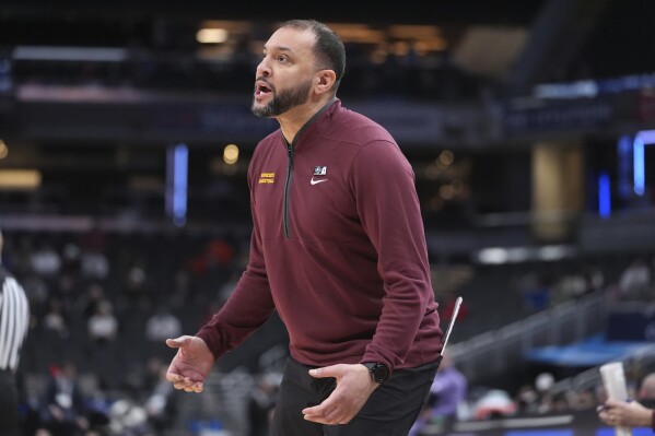 Minnesota head coach Ben Johnson watches against Northwestern during the first half of an NCAA college basketball game in the first round of the Big Ten Conference tournament in Indianapolis, Wednesday, March 12, 2025. (AP Photo/Michael Conroy)