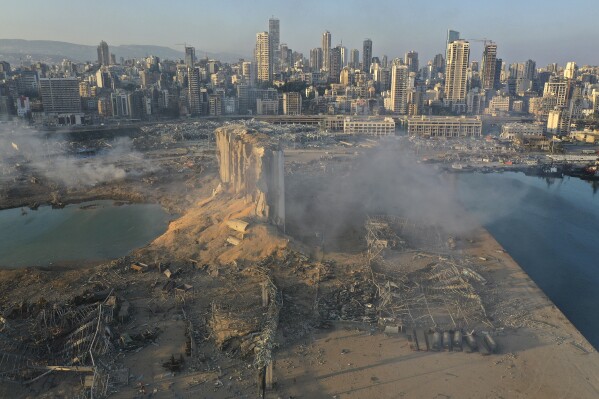 FILE - A drone picture shows the destruction after an explosion at the port of Beirut, on Aug. 5, 2020. A British court has ordered a London-based company that delivered the ammonium nitrates that exploded in 2020 at Beirut's port Beirut killing more than 200 people to pay compensations to some of the families of the victims, Beirut's Bar Association said Tuesday June 13, 2023. (AP Photo/Hussein Malla, File)
